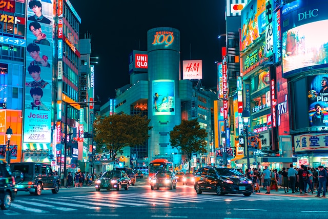 A bustling Japanese city skyline with skyscrapers and crowded roads, highlighting Japan’s contribution to the East Asia market.